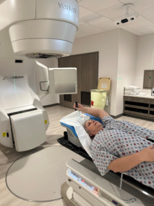 Receiving daily radiation treatment after breast cancer surgery, lying still during a quiet moment in recovery