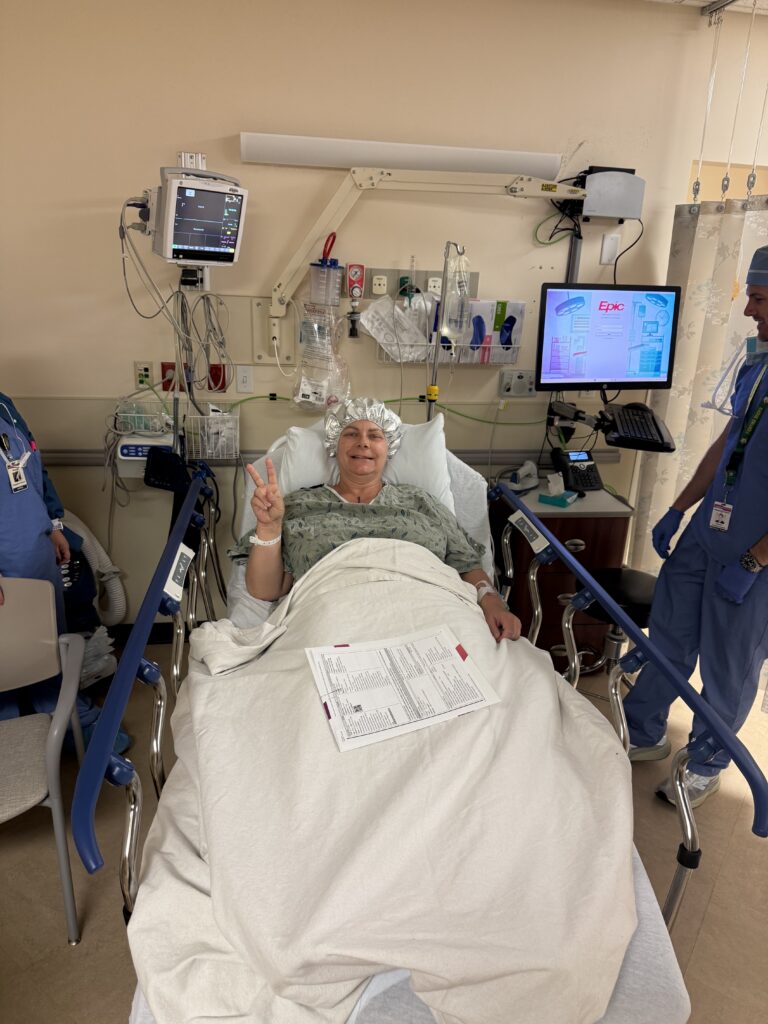 Preparing for breast cancer surgery in hospital bed before double mastectomy.