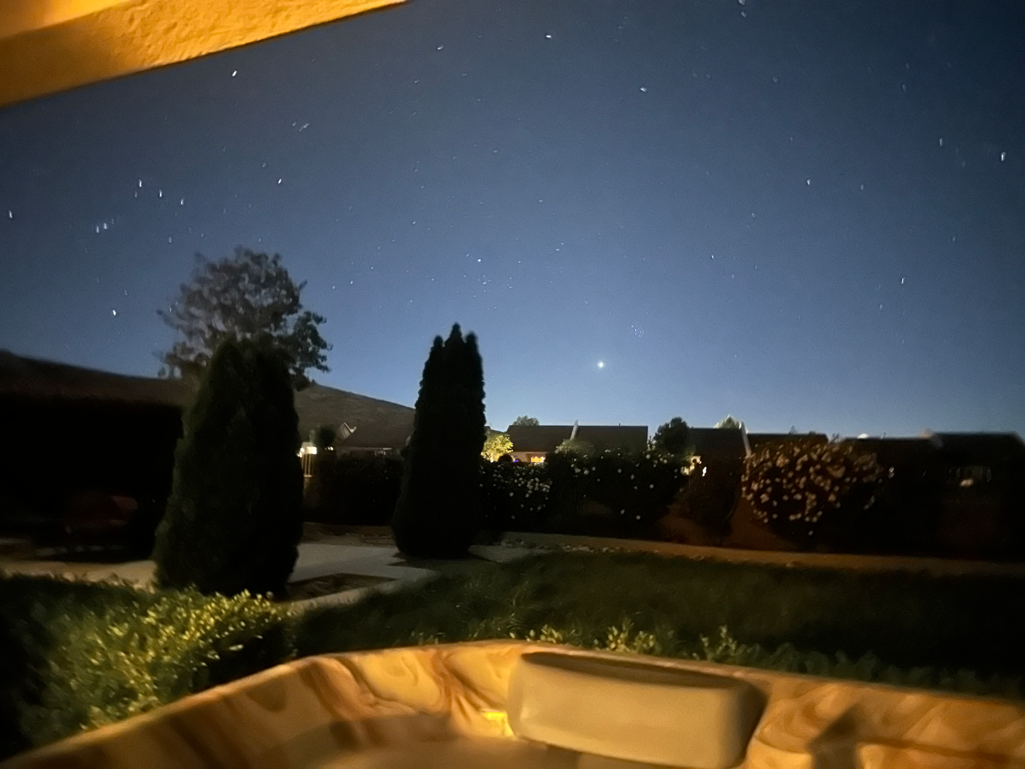 Bright evening sky over backyard with Jupiter shining above the horizon during post-cancer healing reflection