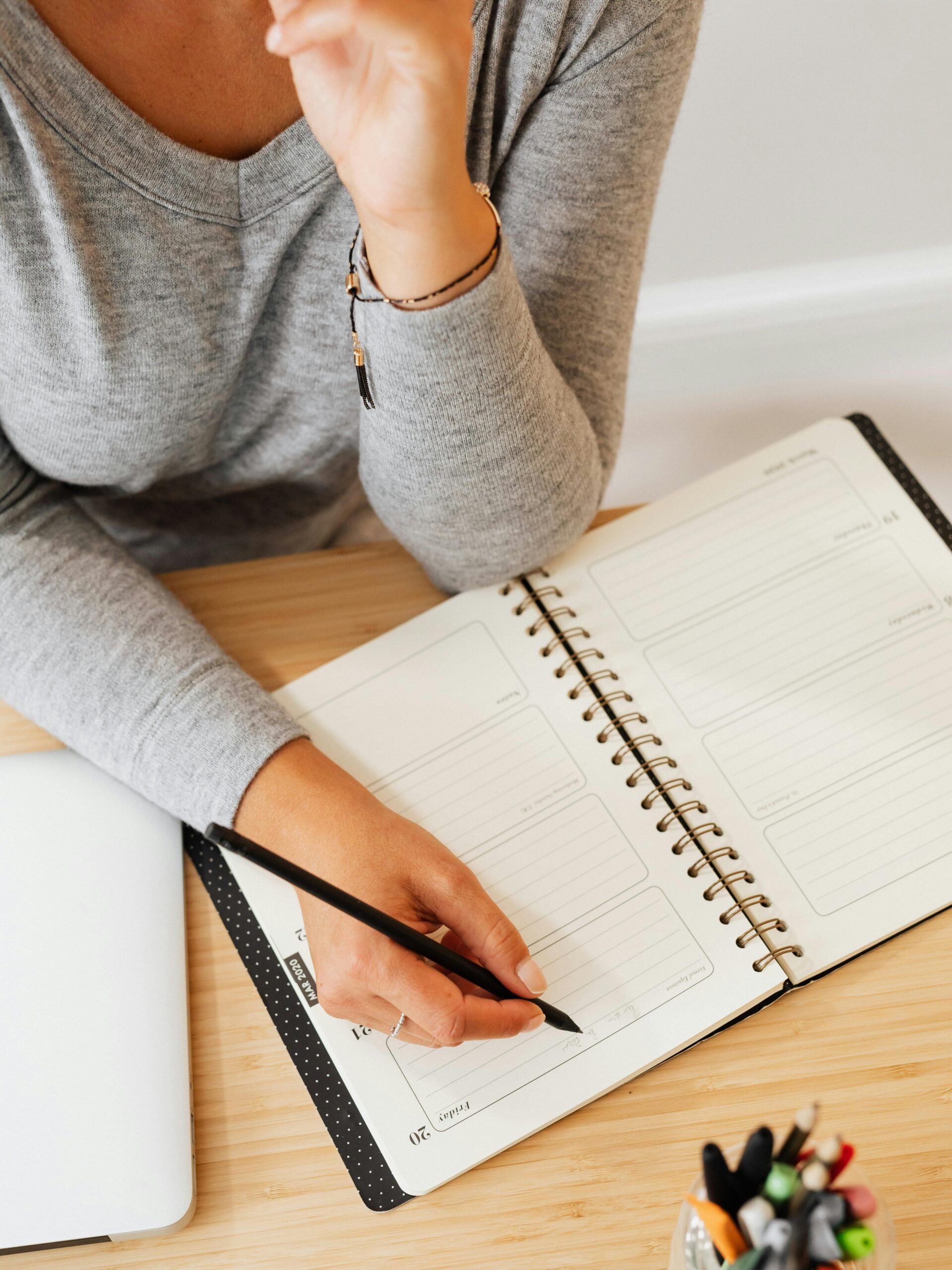 Woman writing in journal post cancer 