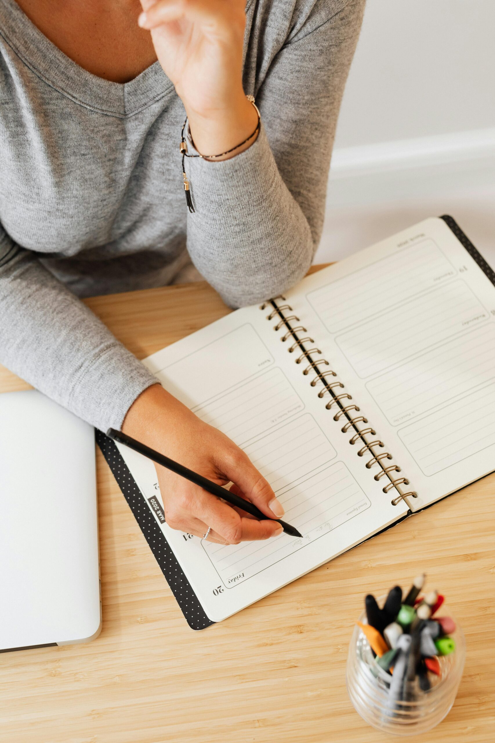 Woman writing in journal post cancer